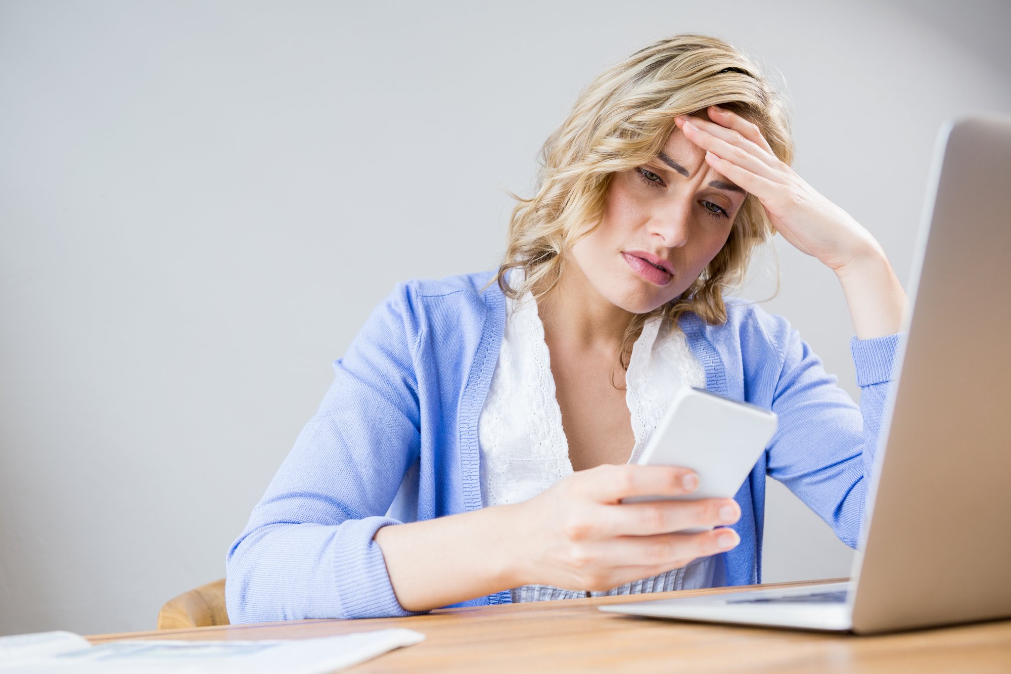 stressed-woman-using-mobile-phone